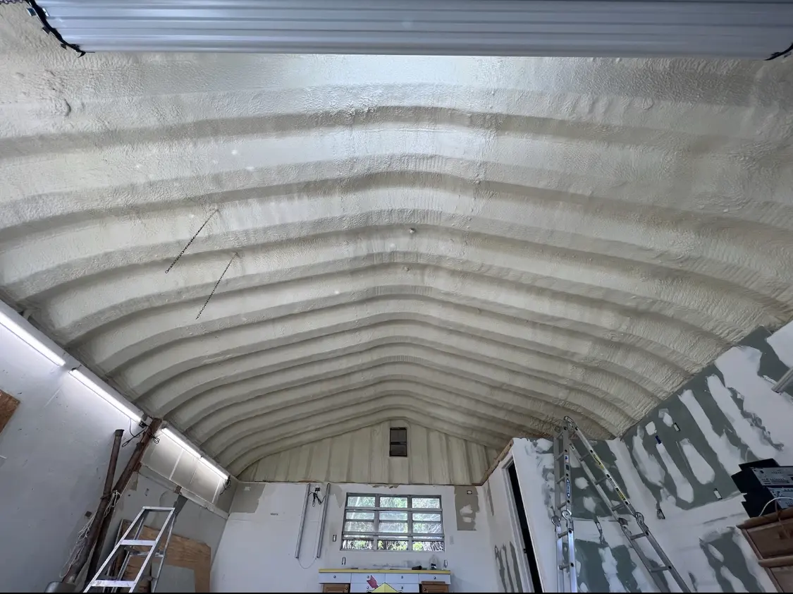 Spray polyurethane foam applied to the underside of a metal roof deck in West Memphis